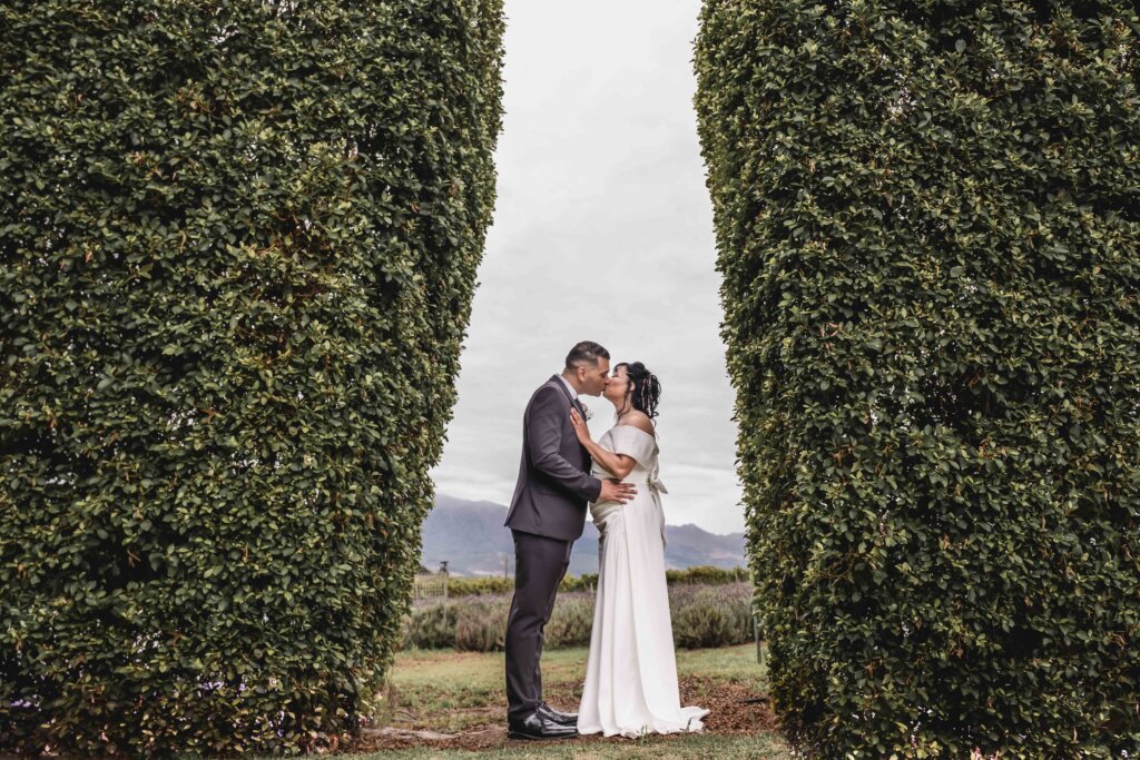 Wedding couple sharing a kiss