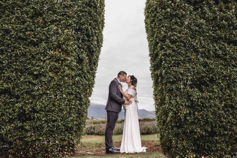 Wedding couple sharing a kiss